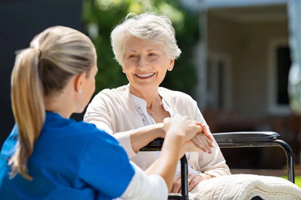 Nurse and woman in a wheelchair